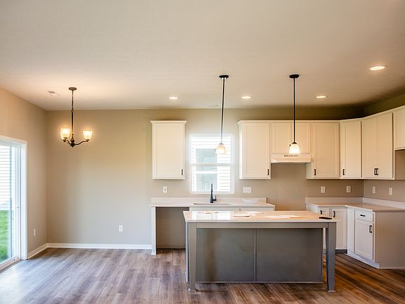 Open kitchen with quartz countertops and stainless steel appliances(installation due)