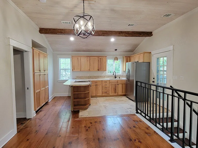 Apartment Full Sized Kitchen, Downdraft Cooktop w/Oven, Full Sized Refrigerator, Large Pantry behind Peninsula