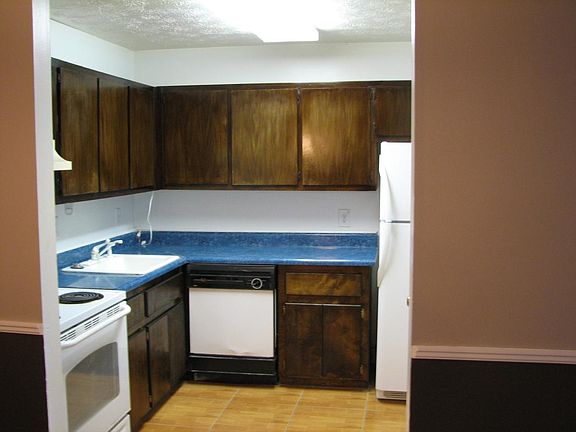 Large kitchen with tile floor and pantry