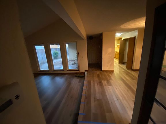 Spacious dining and living areas with view of private courtyard in front.