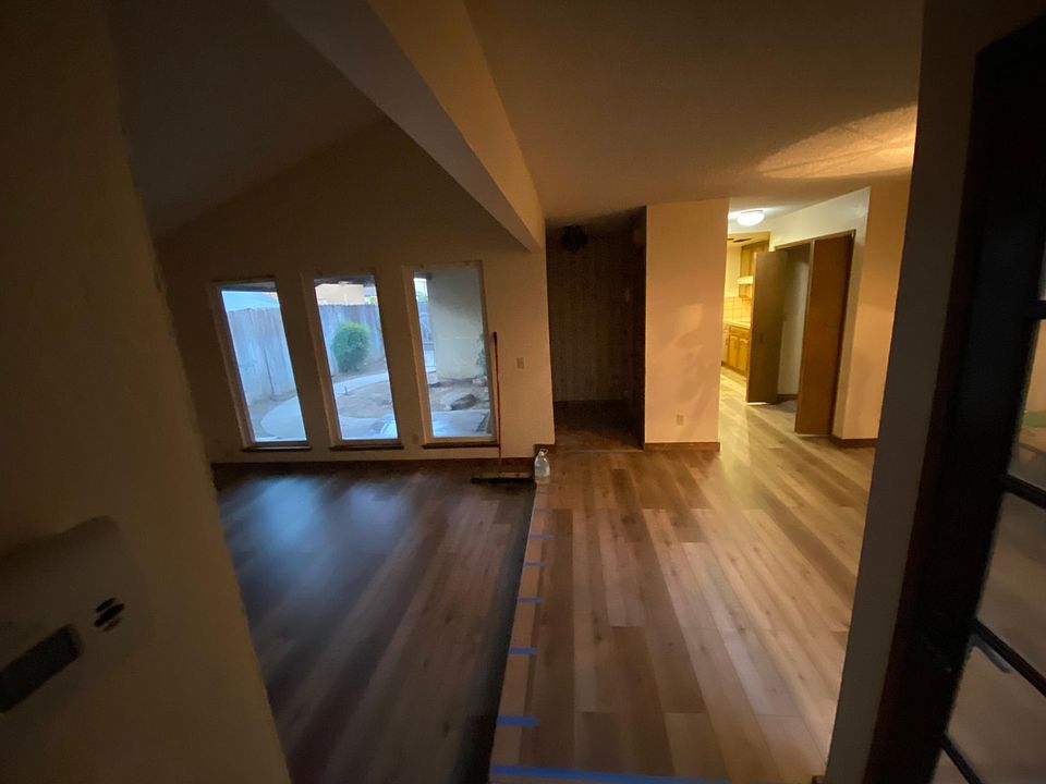 Spacious dining and living areas with view of private courtyard in front.