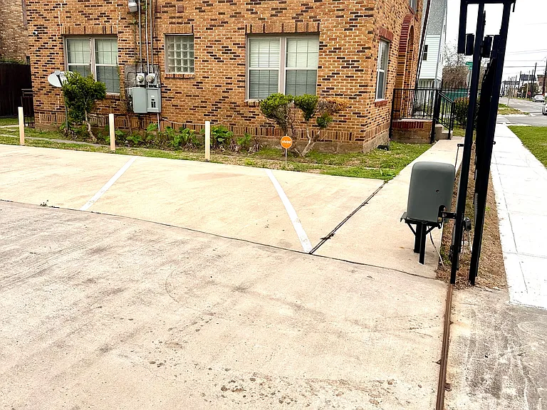 Gated parking lot directly behind the home with a convenient entrance.