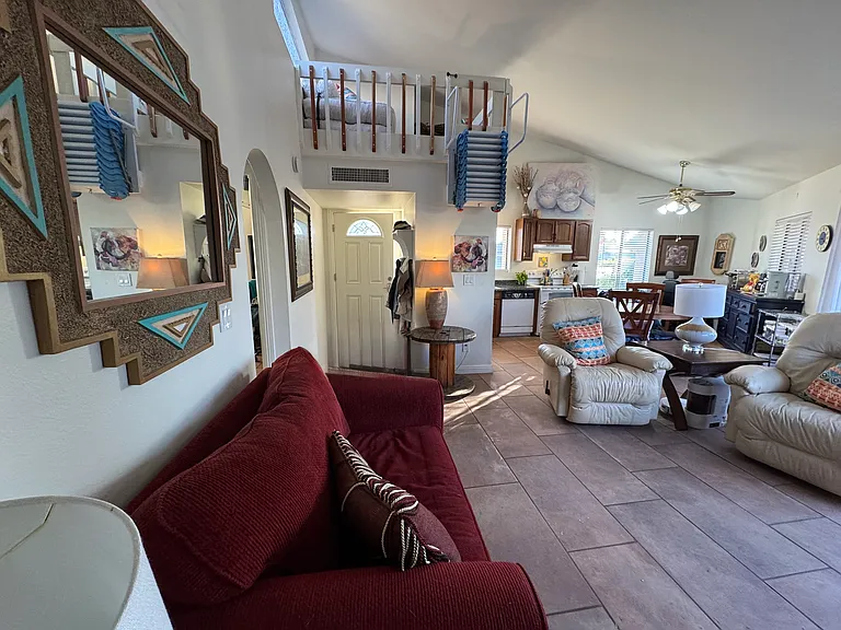 Family room and kitchen along with a glimpse of the loft.