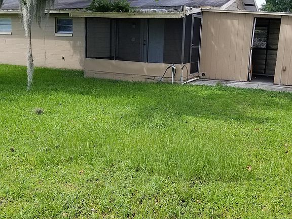 back yard with screened porch and shed