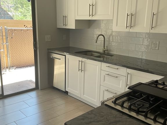 Kitchen Quartz countertops, stainless steel appliances, soft close cabinets