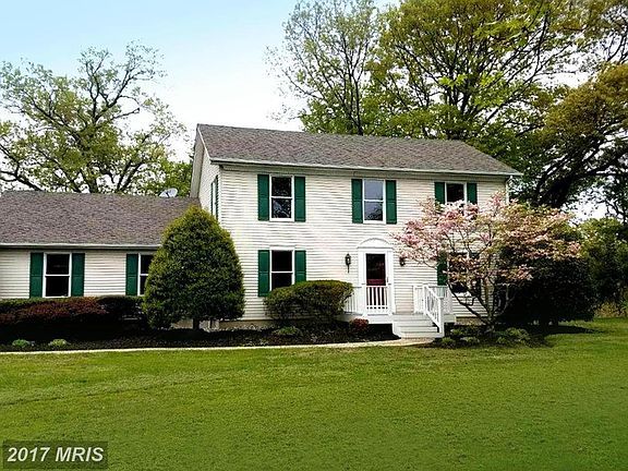 Captivating Colonial Tucked into Riverside Acre