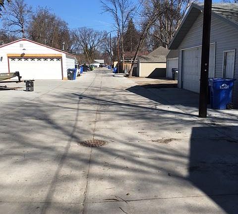 looking north from 11th Ave to 12th. 
Garage on right.