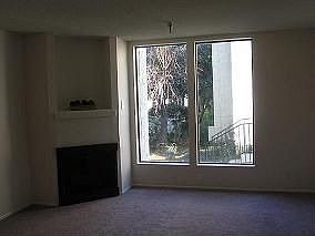 Living room, Fireplace & Window Overlooking Pool