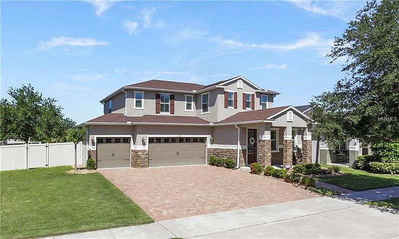 Beautiful stone accents and 3 car garage with full size driveway