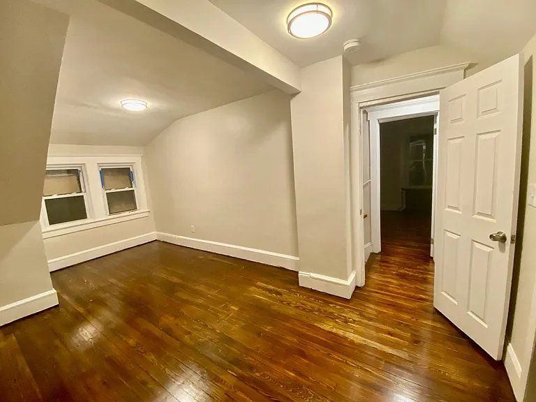 (second floor)right top bedroom with exit door leading to hall and other bedroom