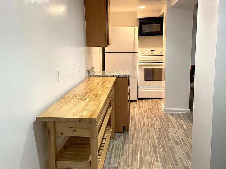 View of kitchen from backdoor entrance