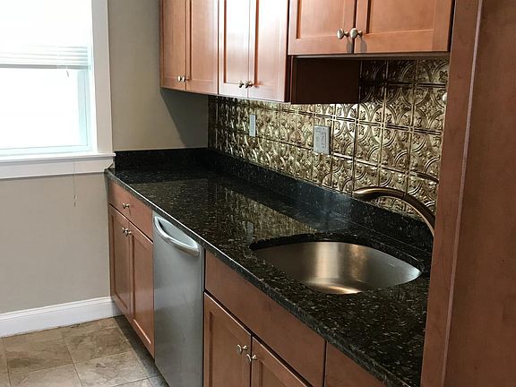 Beautifully updated pantry with granite countertop