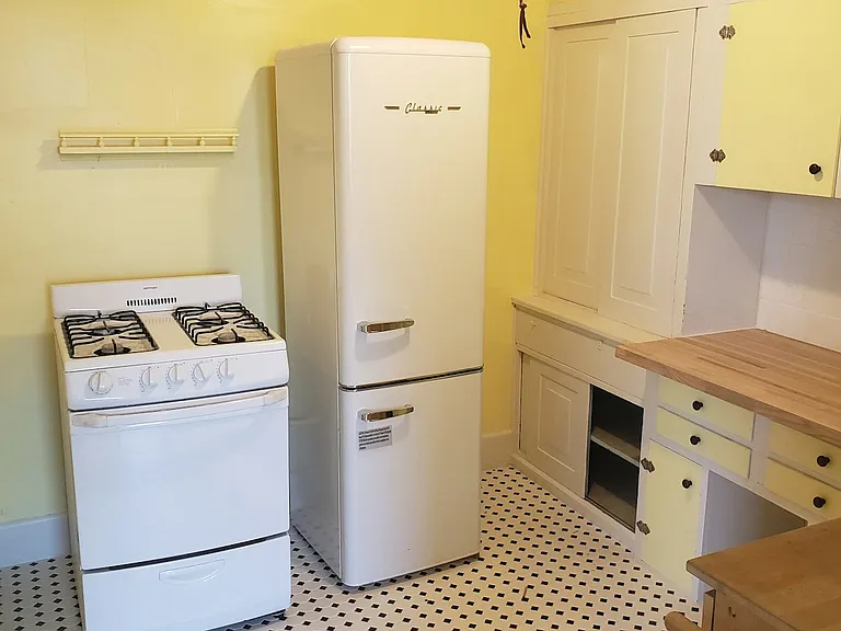 Kitchen. New floor tile. New appliances.