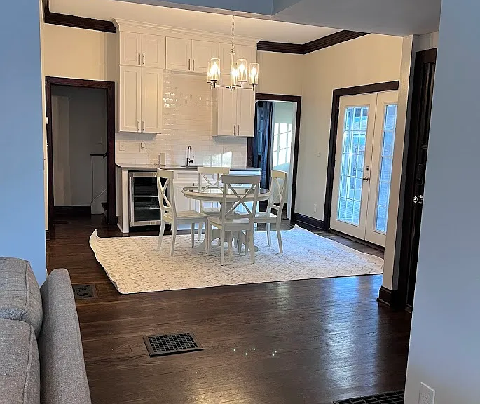 French doors leading to the back yard with screen doors.