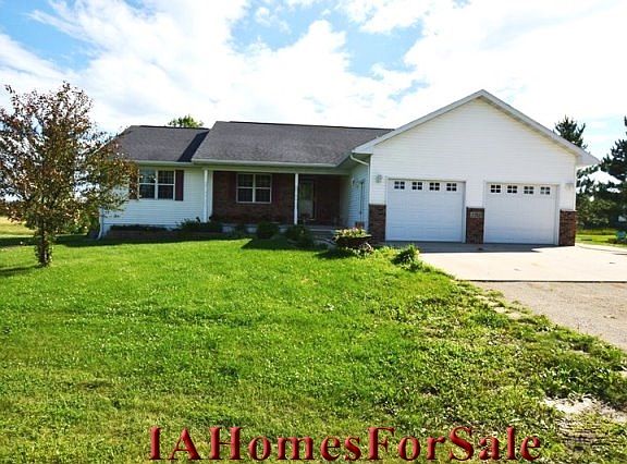 Front view of this spacious 4 bedroom ranch on located on a hard surface road on just outside Independence.  This property size is approximately 2.1 acres lined with evergreens.