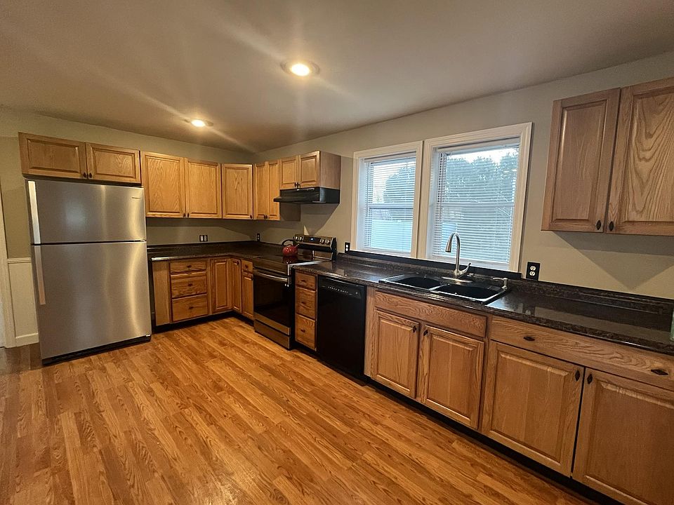 Kitchen with brand new stainless steel appliances.