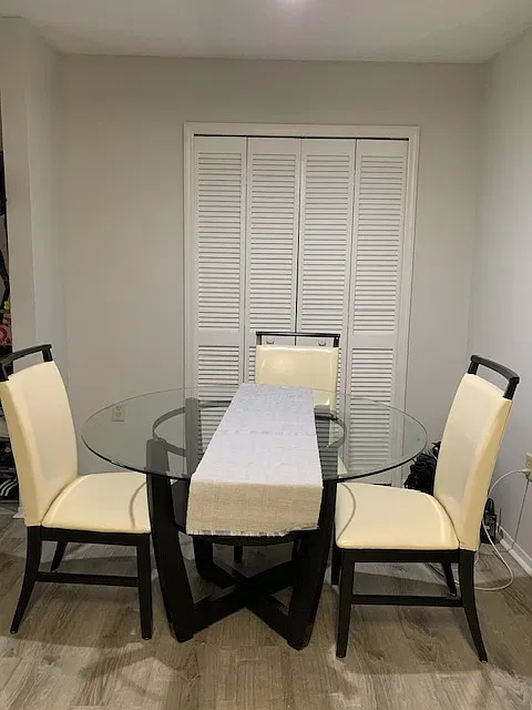 Dining room with dining table and chairs.