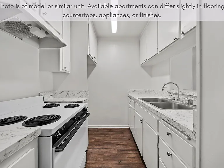 Efficient galley-style kitchen featuring generous cabinet storage and a clean, practical design.