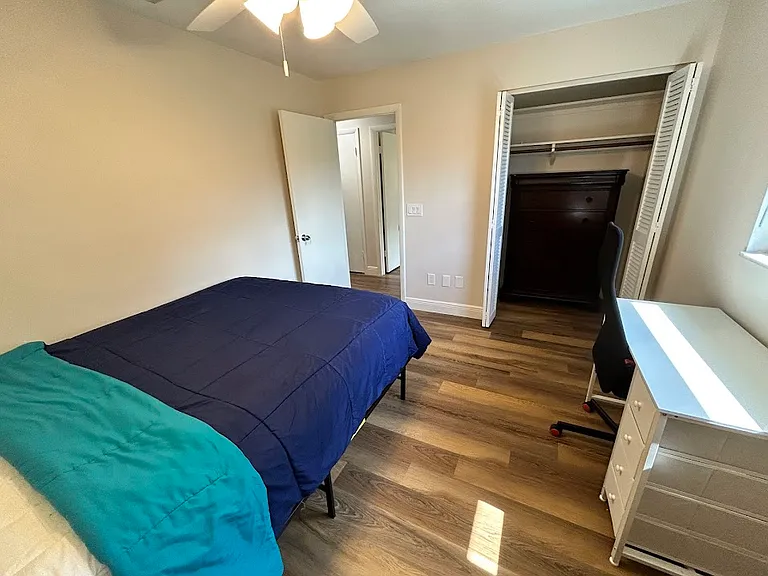 Bedroom 3 - Queen mattress, desk with chair, side table with lamp, chair, dresser