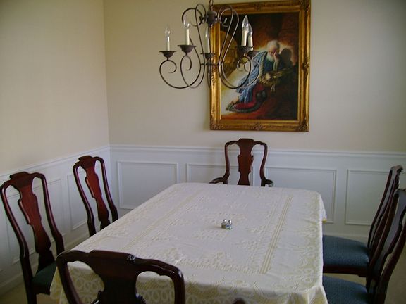 Dining room features chair rail and crown molding