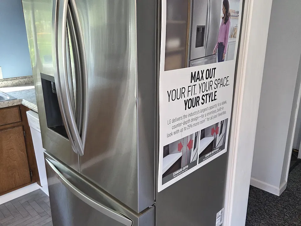 New French door fridge. (I'll take the sales magnet off when you rent, no worries)