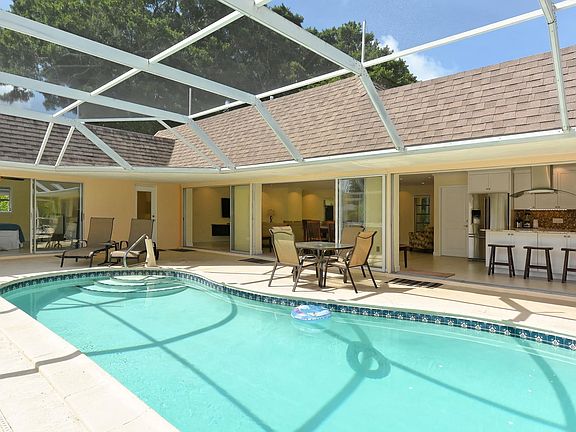 Heated private pool with deck chairs and loungers