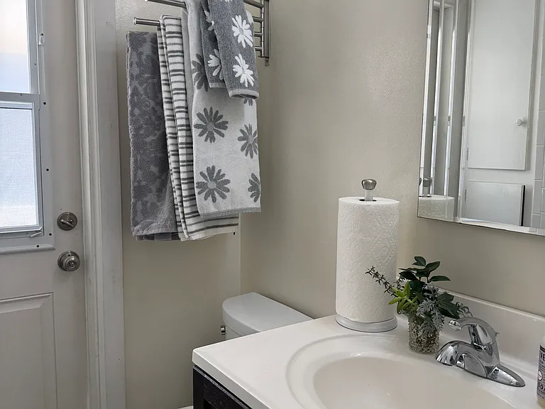 Bathroom and door to private balcony