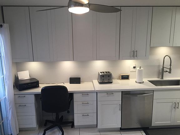 Kitchen - built-in desk, ample storage.