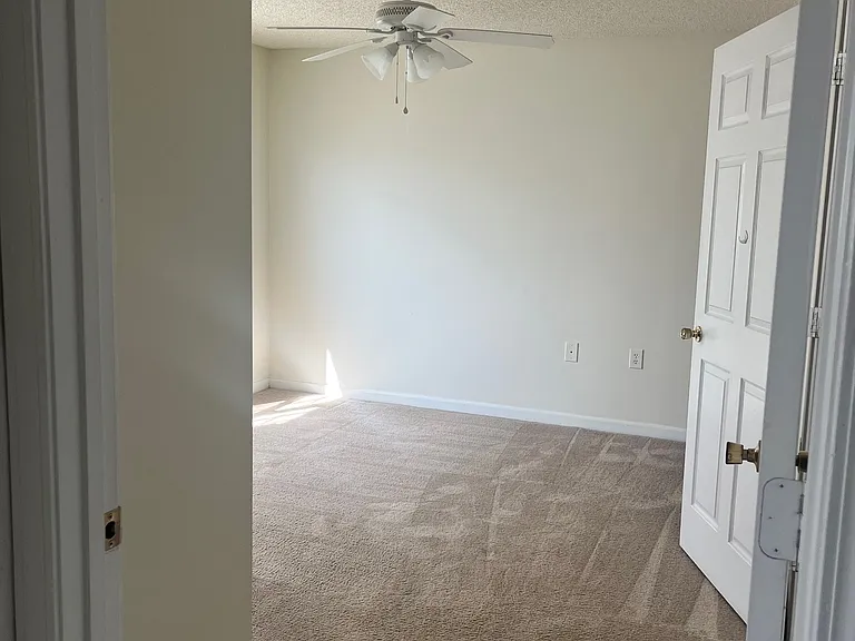 Bedroom one with in-suite bathroom. Non-remodeled