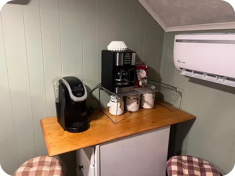 2nd floor kitchen with microwave, electric cook top, hot air fryer, desktop oven, blender, cups dishes utensils, coffee makers, compact fridge. Most everything you'll need