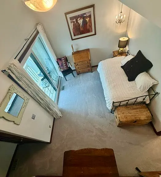 Second Story Bedroom with a Trundle Bed that goes from a Twin to a King Bed and a balcony with views of Park City Mountain Resort.