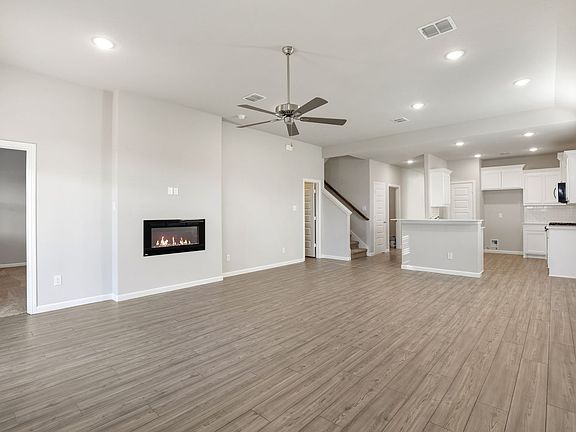 Living room in the Sapphire home plan by Trophy Signature Homes - REPRESENTATIVE PHOTO