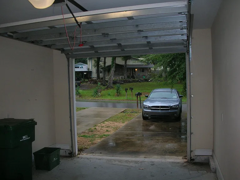 One car garage with electric door opener.