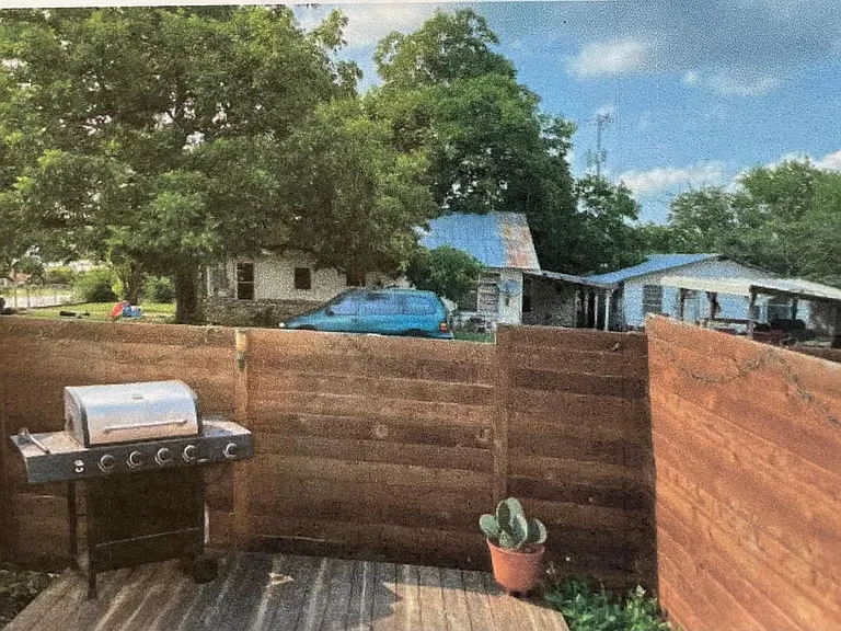 small fenced back yard