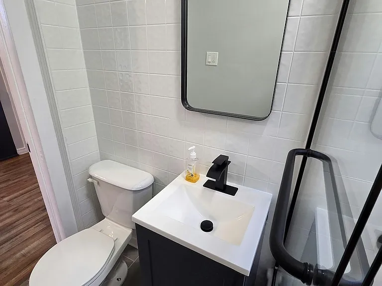 New tile floor, new vanity, new mirror, new glazed/painted walls