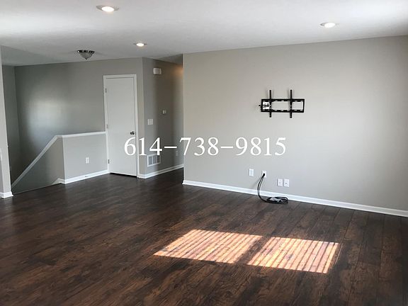 Living room with tv mount and HDMI cables upper level