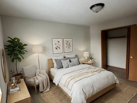 Main floor bedrooms have the wood look plank flooring