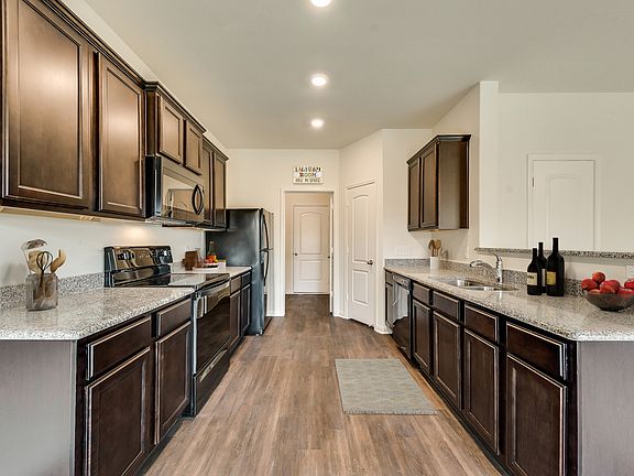 The Cypress by LGI Homes includes a full suite of Whirlpool kitchen appliances.
