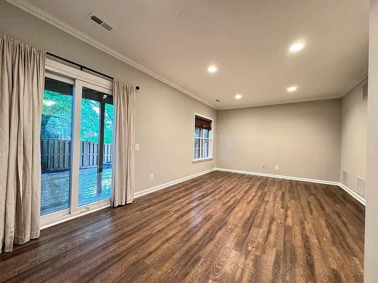GROUND LEVEL BONUS ROOM WALKS OUT TO BEAUTIFUL PATIO
