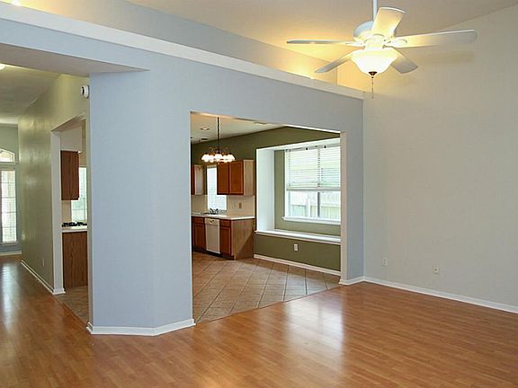 The flowing open floorplan with laminate wood flooring is light and bright!