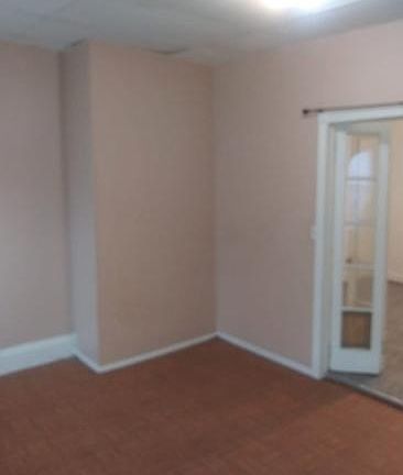 fresh paint and clean! living area doors open to the bedroom