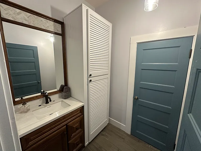 Sink Room: connects to bath and to dining room, a door separates each space