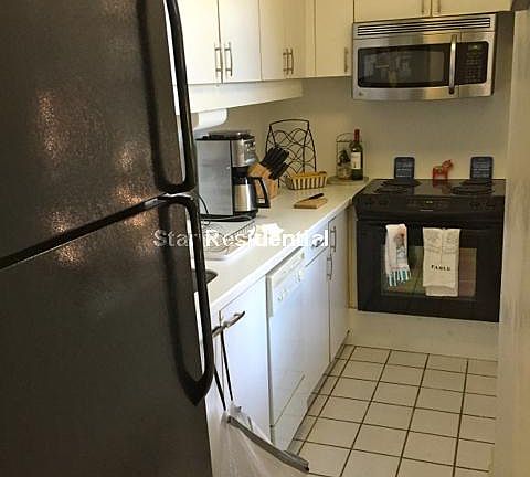Kitchen with dishwasher off the living room