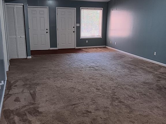 View from rear entrance. Door on left stores the furnace, middle door enters to the 2 car garage. Door on the right is front entrance door.