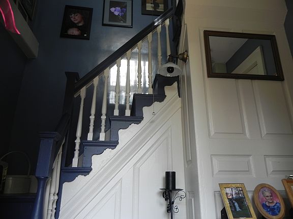Front Hallway with detailed woodwork & wainscoting