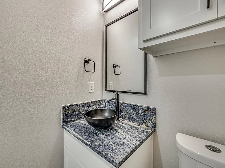 Half bath is locating on the first floor next to the living room and a big walk in closet for storage