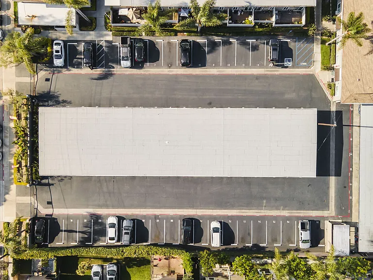 Aerial view of parking at Olive Tree Townhomes in Costa Mesa, CA