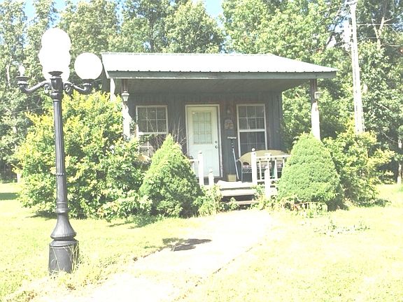 SMALL CABIN BY THE POND