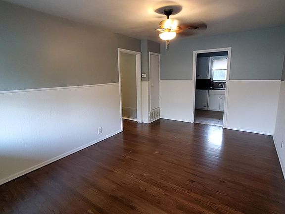Living Area with windows looking out to tghe front yard, so you can see your friends coming as you watch TV.