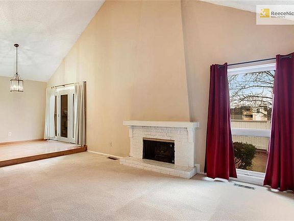 Open floor plan.  Soaring vaulted ceilings. Great Room with fireplace; opens to Kitchen & Dining